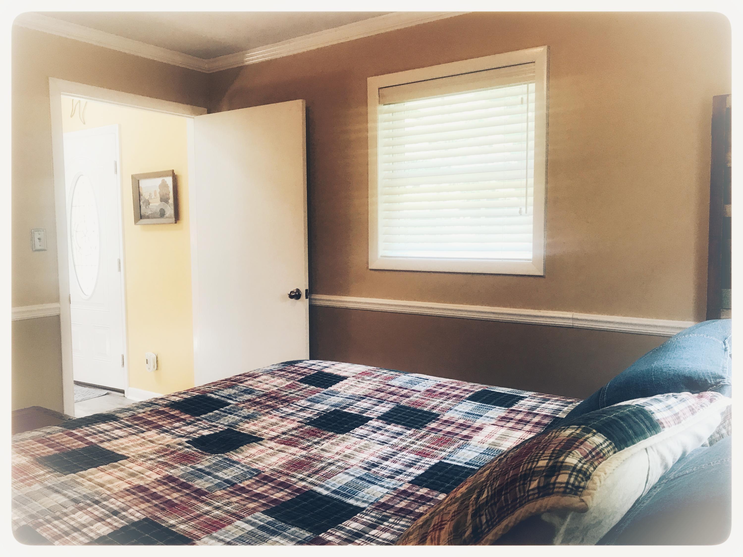 131 Highland Lake Road Union Hall, VA 24176 - Photo 51 of 75 a bedroom with a bed and a window