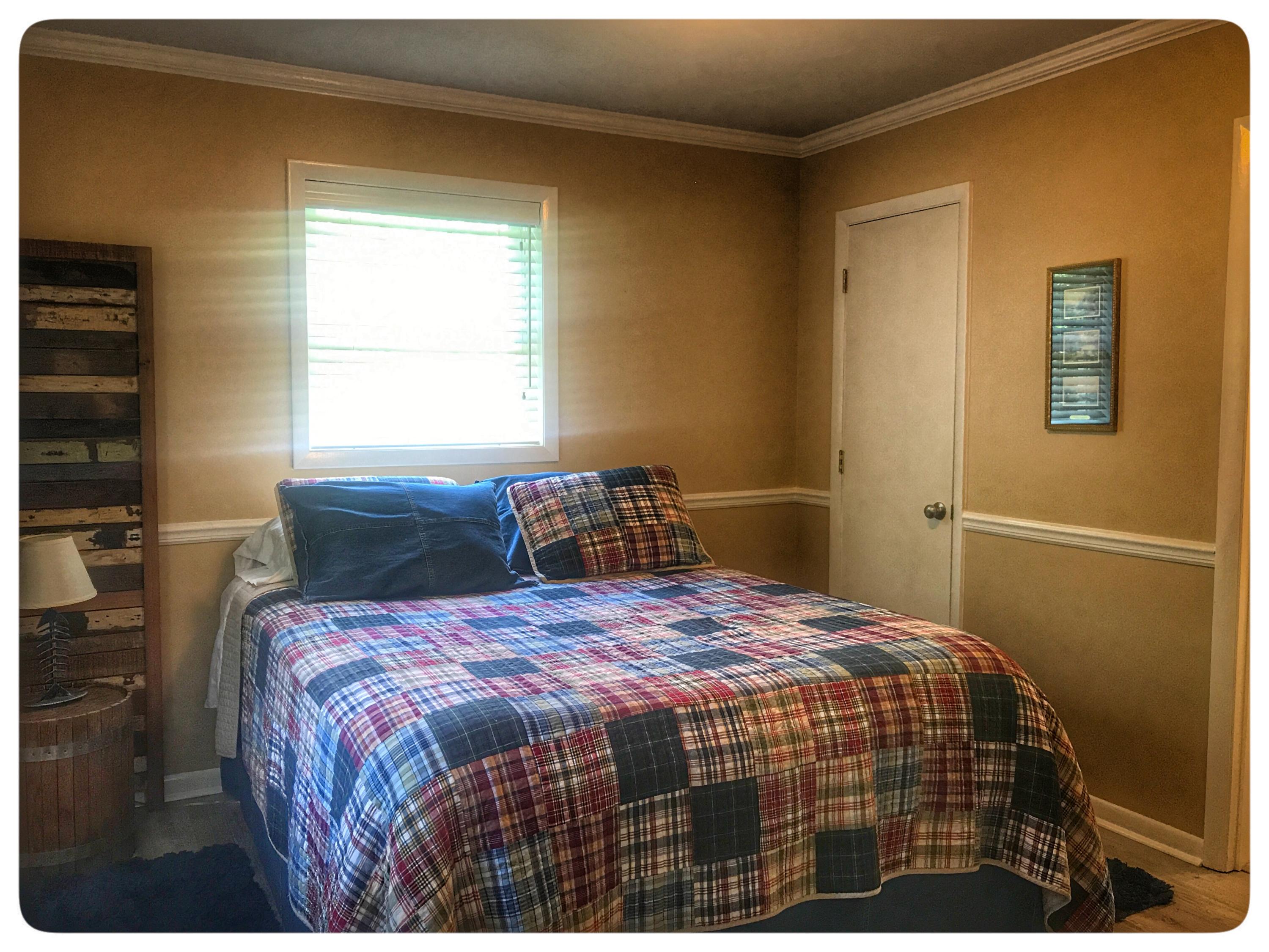 131 Highland Lake Road Union Hall, VA 24176 - Photo 52 of 75 a bedroom with a bed and window