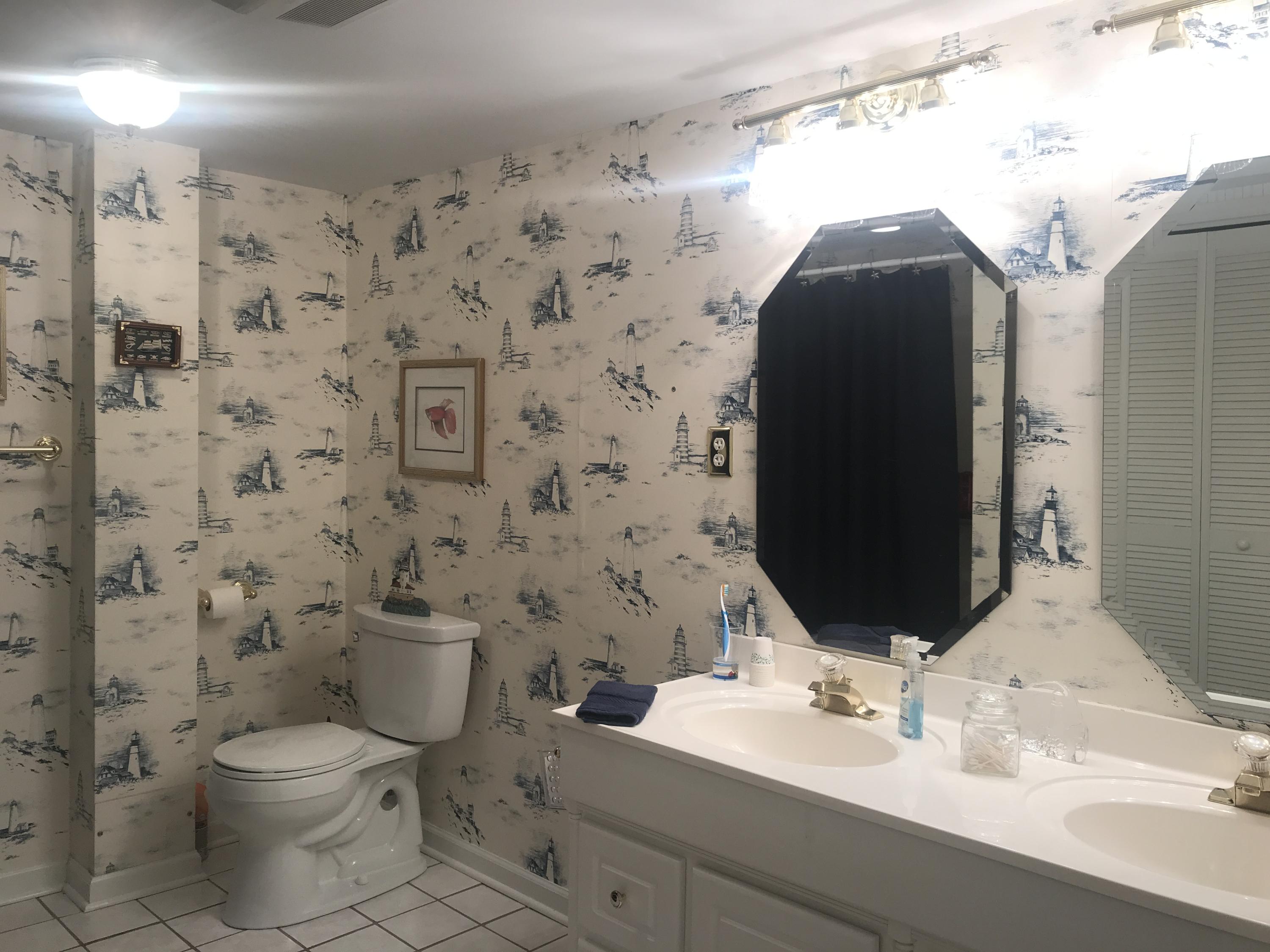 131 Highland Lake Road Union Hall, VA 24176 - Photo 64 of 75 a bathroom with a toilet sink and mirror