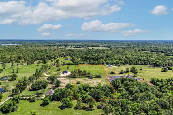 an aerial view of a houses with outdoor space
