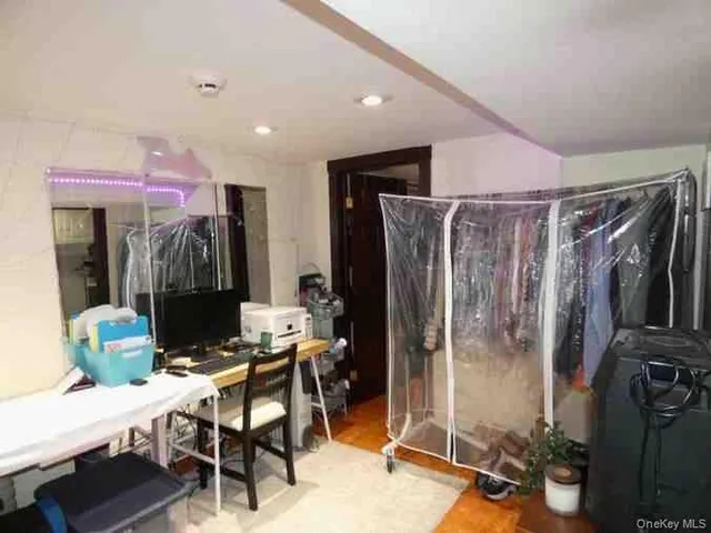 a view of a livingroom with furniture and gym equipment