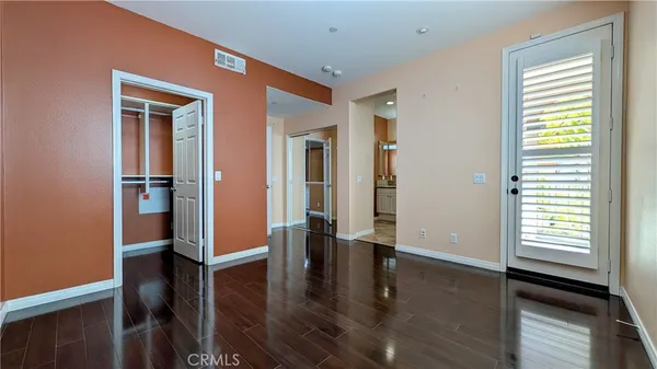 a view of entryway with livingroom and wooden floor