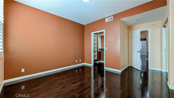 a view of room with wooden floor
