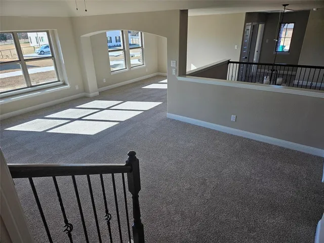 a view of an empty room with windows