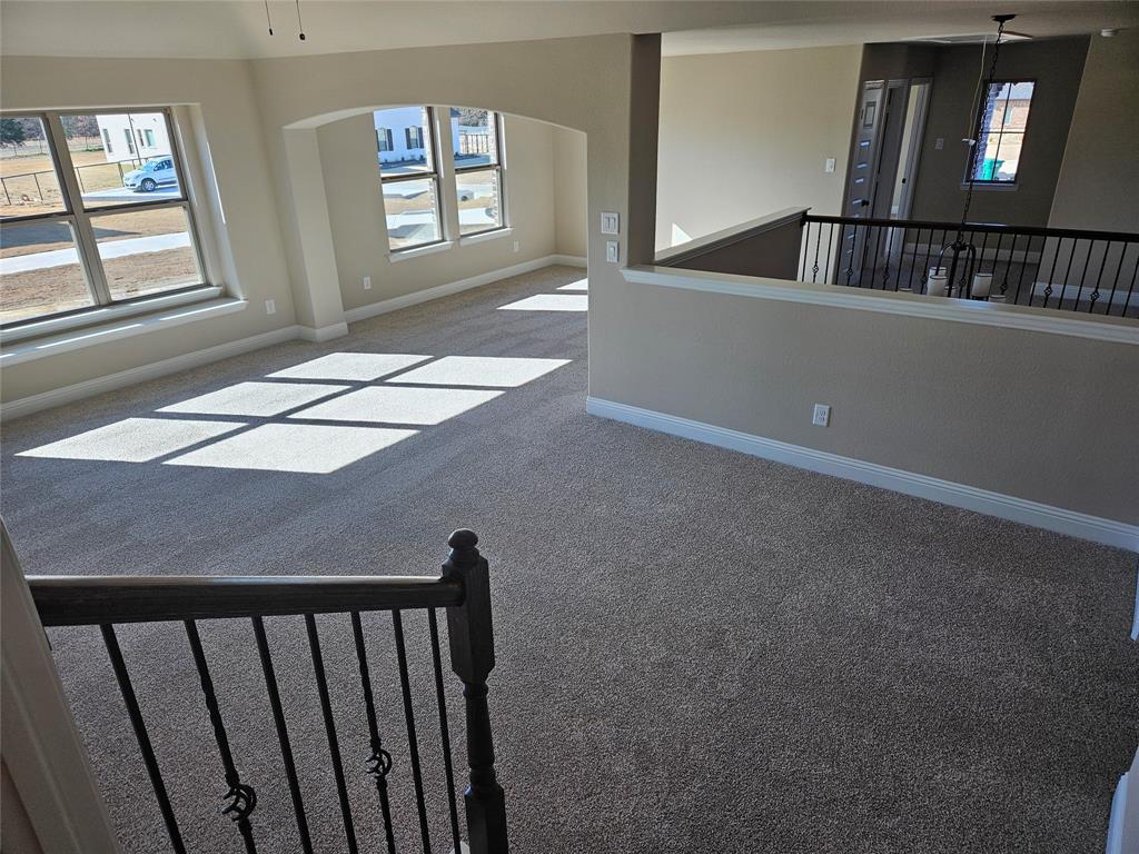 128 Red Fox Trail Godley, TX 76044 - Photo 15 of 19 a view of an empty room with windows