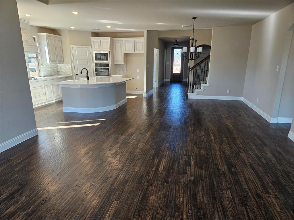 128 Red Fox Trail Godley, TX 76044 - Photo 5 of 19 a living room with stainless steel appliances furniture floors and wooden floor
