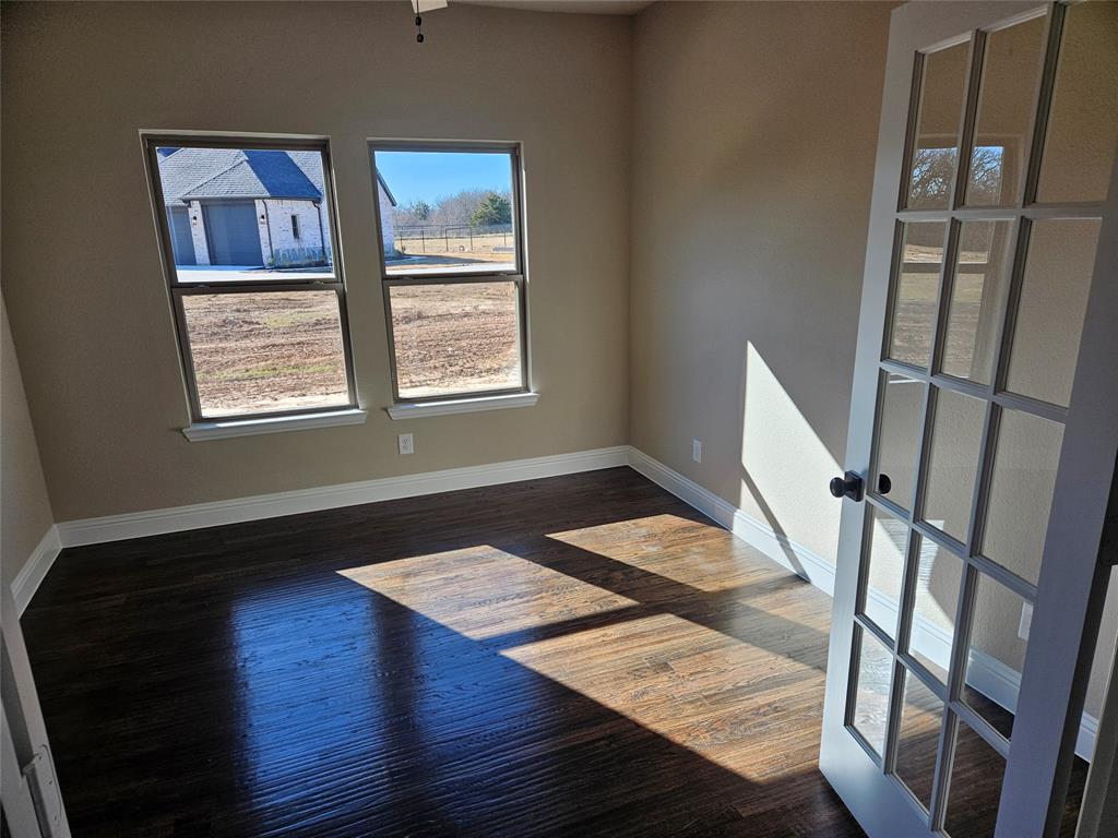 128 Red Fox Trail Godley, TX 76044 - Photo 10 of 19 a living room with wooden floor and a window