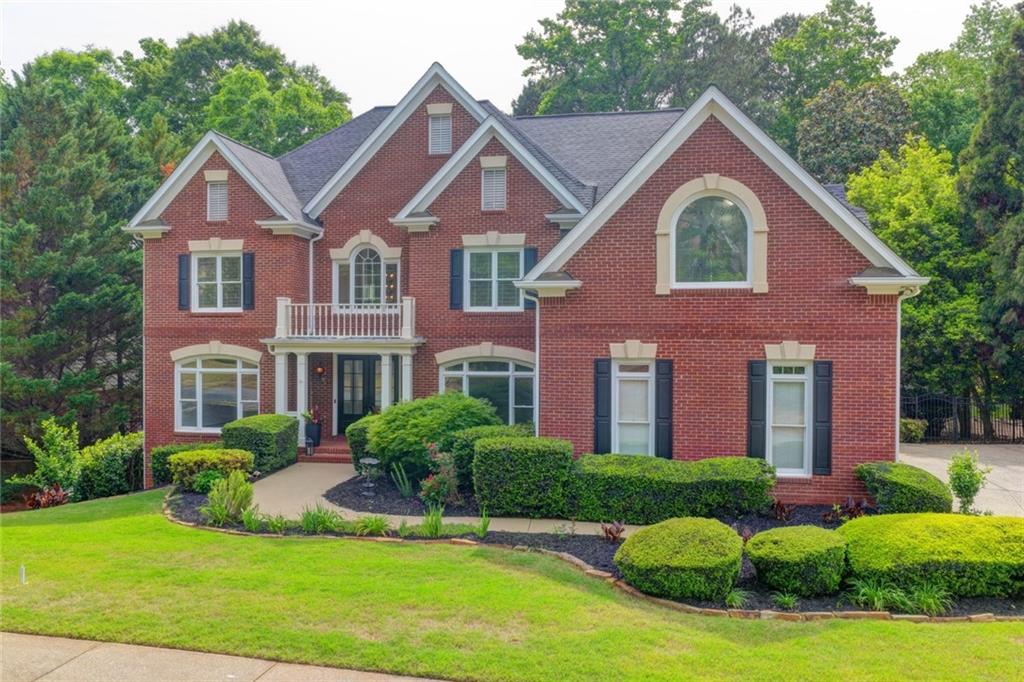 855 Autumn Close Alpharetta, GA 30004 - Photo 1 of 154 a front view of a house with a yard