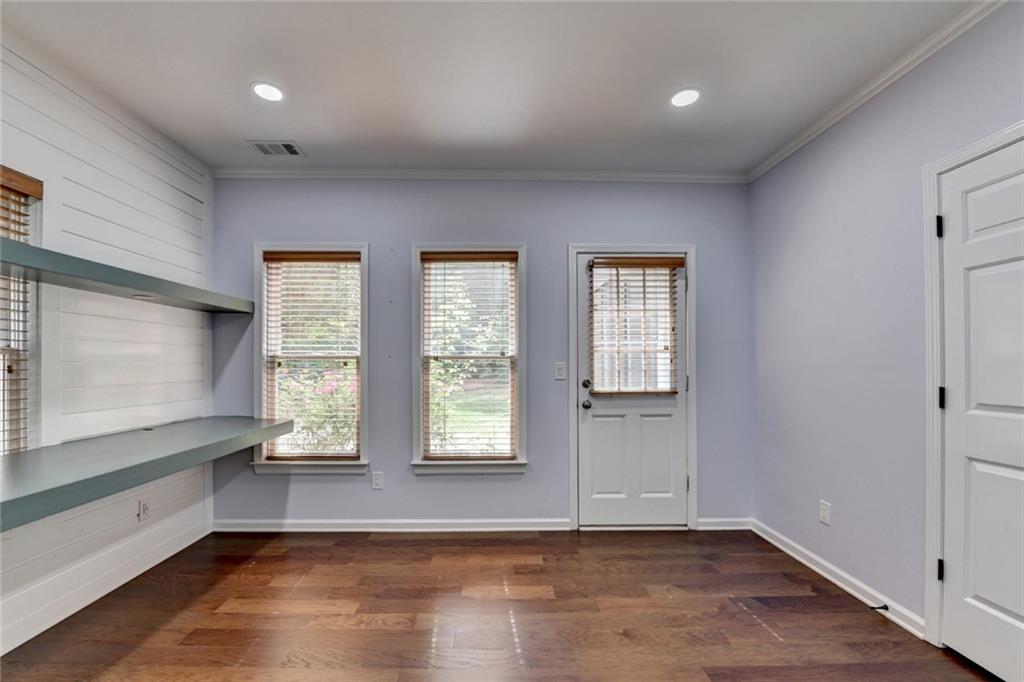 855 Autumn Close Alpharetta, GA 30004 - Photo 109 of 154 a view of an empty room with wooden floor and a window