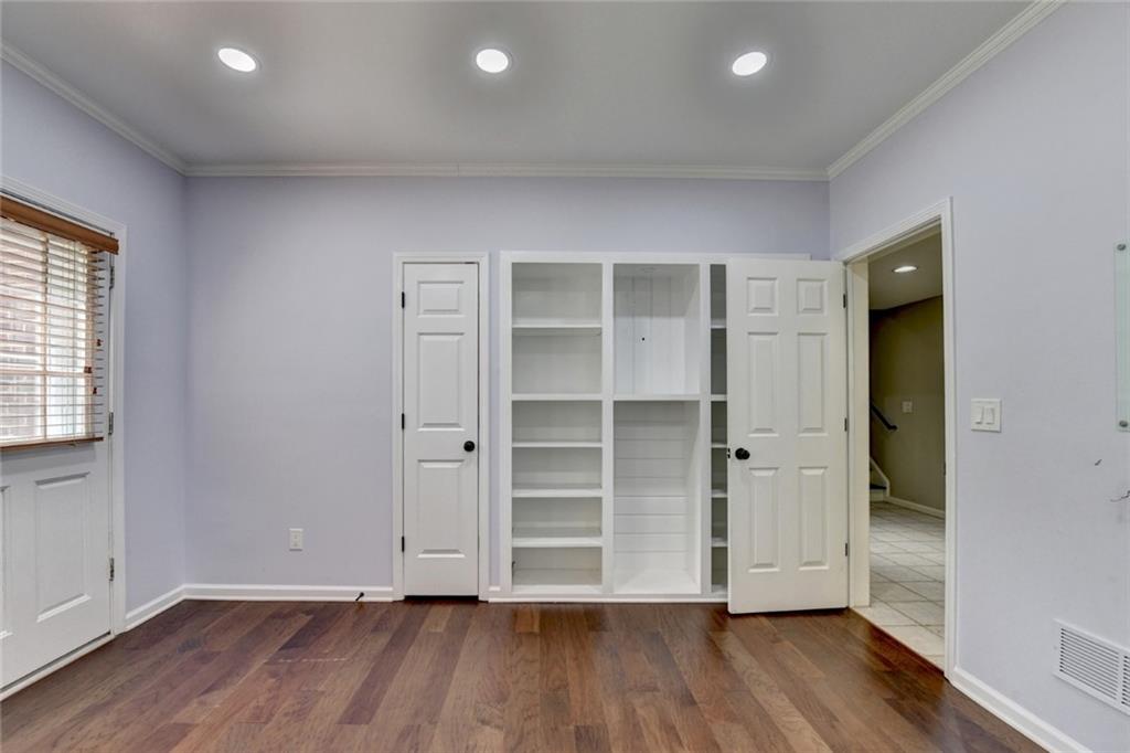 855 Autumn Close Alpharetta, GA 30004 - Photo 110 of 154 an empty room with wooden floor & closet area