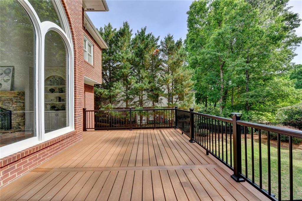 855 Autumn Close Alpharetta, GA 30004 - Photo 125 of 154 a view of balcony with wooden floor and fence