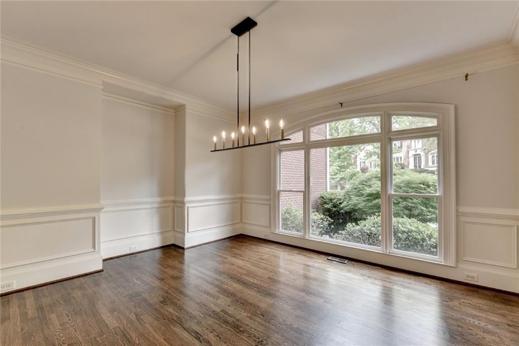 855 Autumn Close Alpharetta, GA 30004 - Photo 13 of 154 a view of empty room with wooden floor and fan