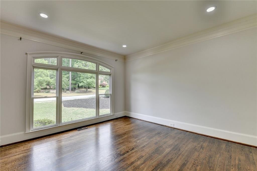 855 Autumn Close Alpharetta, GA 30004 - Photo 17 of 154 a view of empty room with wooden floor and fan