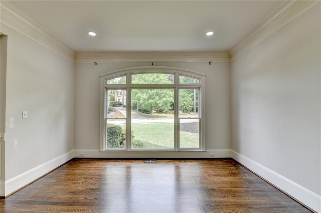 855 Autumn Close Alpharetta, GA 30004 - Photo 20 of 154 a view of an empty room with wooden floor and a window