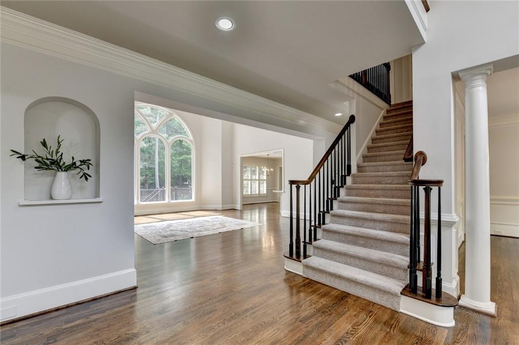 855 Autumn Close Alpharetta, GA 30004 - Photo 24 of 154 a view of an entryway with wooden floor and front door