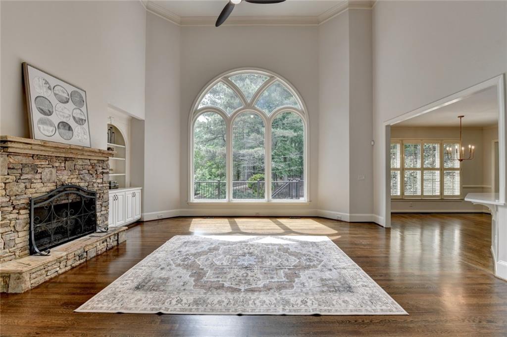 855 Autumn Close Alpharetta, GA 30004 - Photo 26 of 154 a view of an empty room with wooden floor and a fireplace