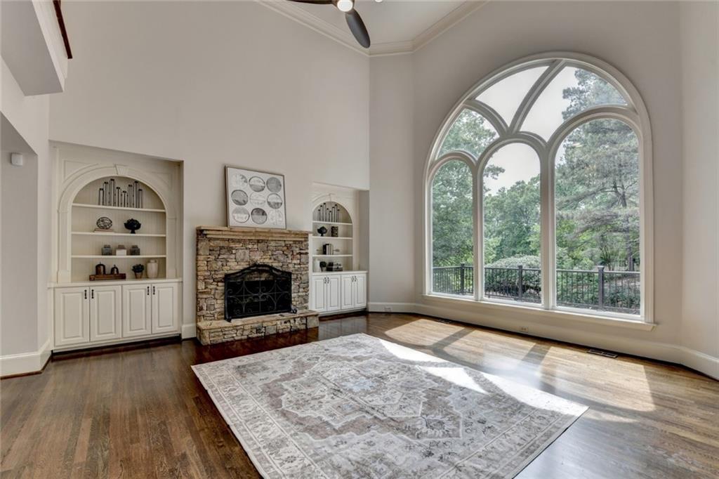 855 Autumn Close Alpharetta, GA 30004 - Photo 27 of 154 a view of a livingroom with a fireplace wooden floor and windows