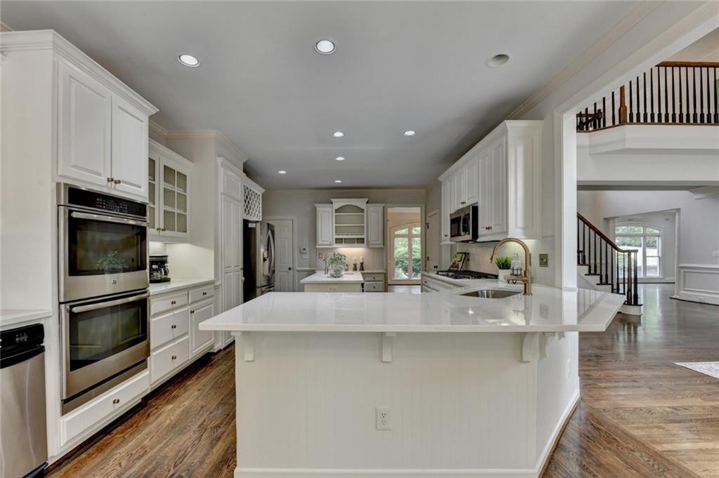 855 Autumn Close Alpharetta, GA 30004 - Photo 38 of 154 a large kitchen with stainless steel appliances lots of counter space and a refrigerator