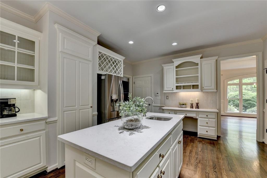 855 Autumn Close Alpharetta, GA 30004 - Photo 47 of 154 a kitchen with a sink a stove a refrigerator and cabinets