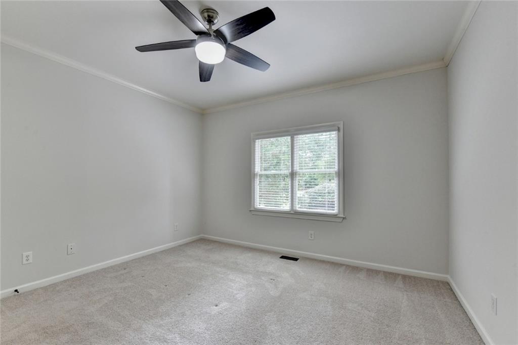 855 Autumn Close Alpharetta, GA 30004 - Photo 53 of 154 an empty room with a window and a fan