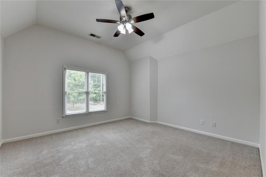 855 Autumn Close Alpharetta, GA 30004 - Photo 71 of 154 an empty room with a window and a fan
