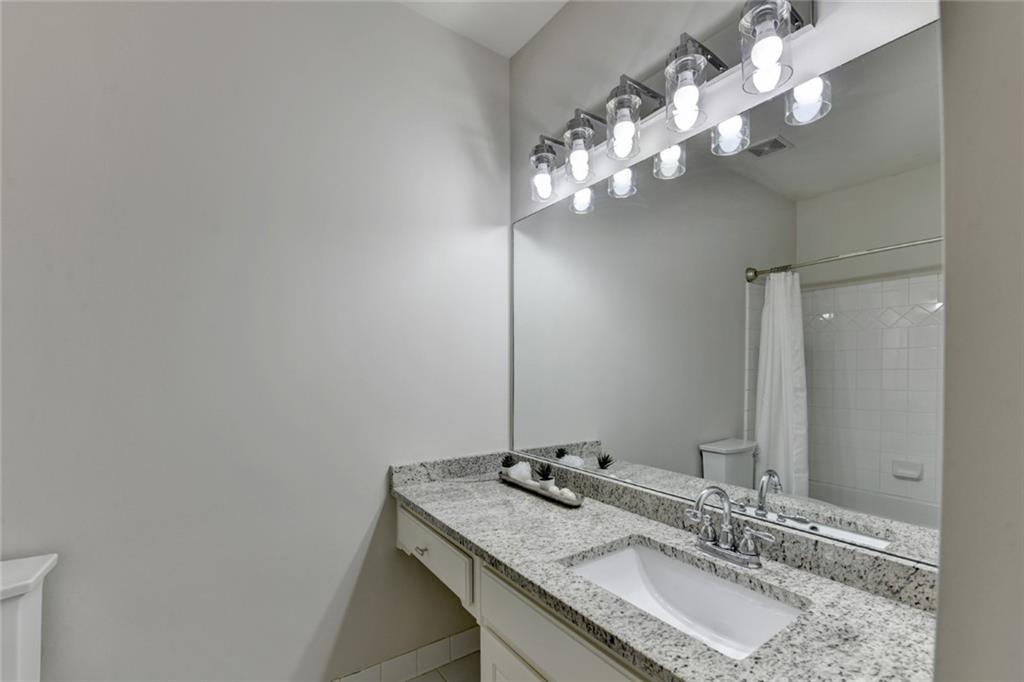 855 Autumn Close Alpharetta, GA 30004 - Photo 73 of 154 a bathroom with a granite countertop sink and a mirror