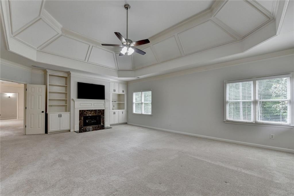 855 Autumn Close Alpharetta, GA 30004 - Photo 81 of 154 a view of an empty room with a fireplace and a window