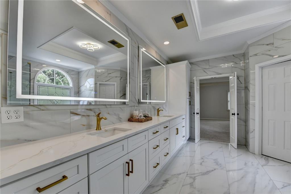 855 Autumn Close Alpharetta, GA 30004 - Photo 86 of 154 a spacious bathroom with double sink and a mirror