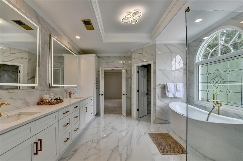 855 Autumn Close Alpharetta, GA 30004 - Photo 90 of 154 a spacious bathroom with a double vanity sink a mirror and a shower
