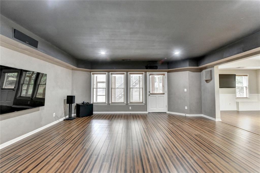 855 Autumn Close Alpharetta, GA 30004 - Photo 94 of 154 a view of an empty room with wooden floor and a window