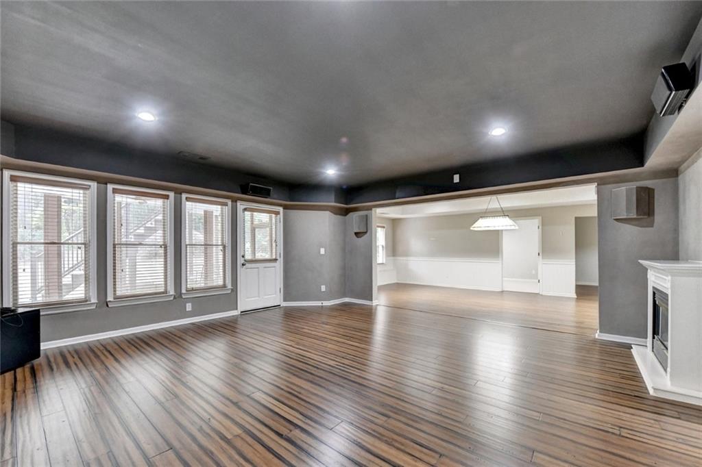 855 Autumn Close Alpharetta, GA 30004 - Photo 95 of 154 a view of an empty room with wooden floor and a window