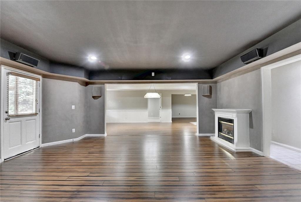 855 Autumn Close Alpharetta, GA 30004 - Photo 96 of 154 a view of an empty room with wooden floor and a window
