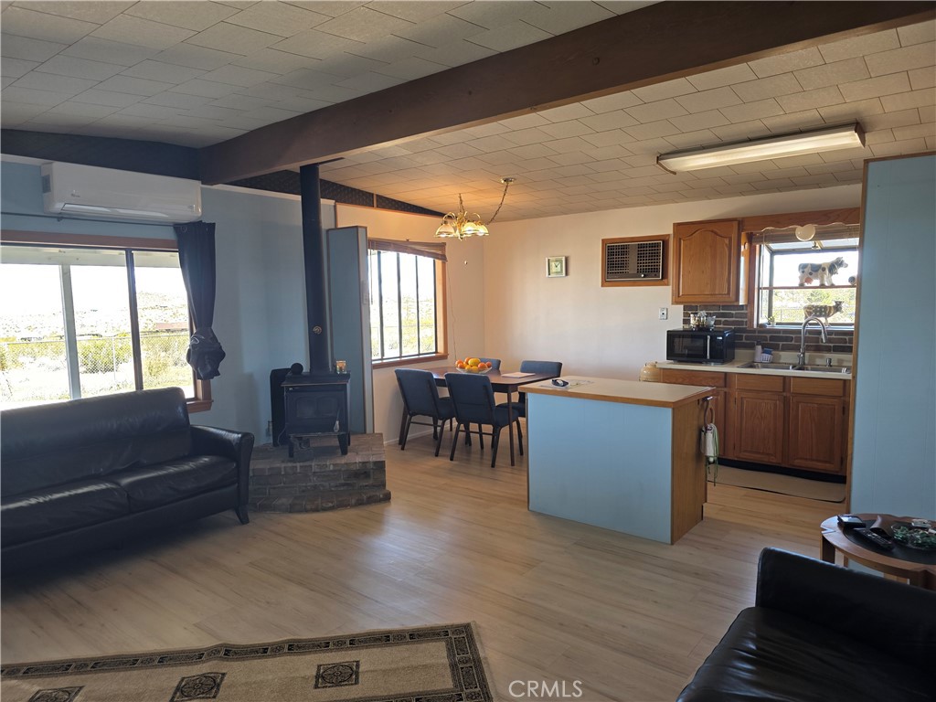 5566 Oleta Road Landers, CA 92285 - Photo 11 of 40 a living room with furniture and a large window