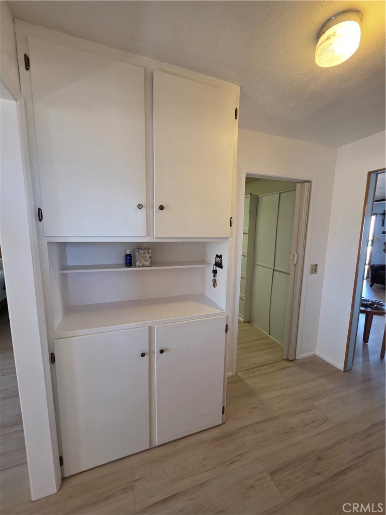 5566 Oleta Road Landers, CA 92285 - Photo 15 of 40 a view of a kitchen with closet and wooden floor