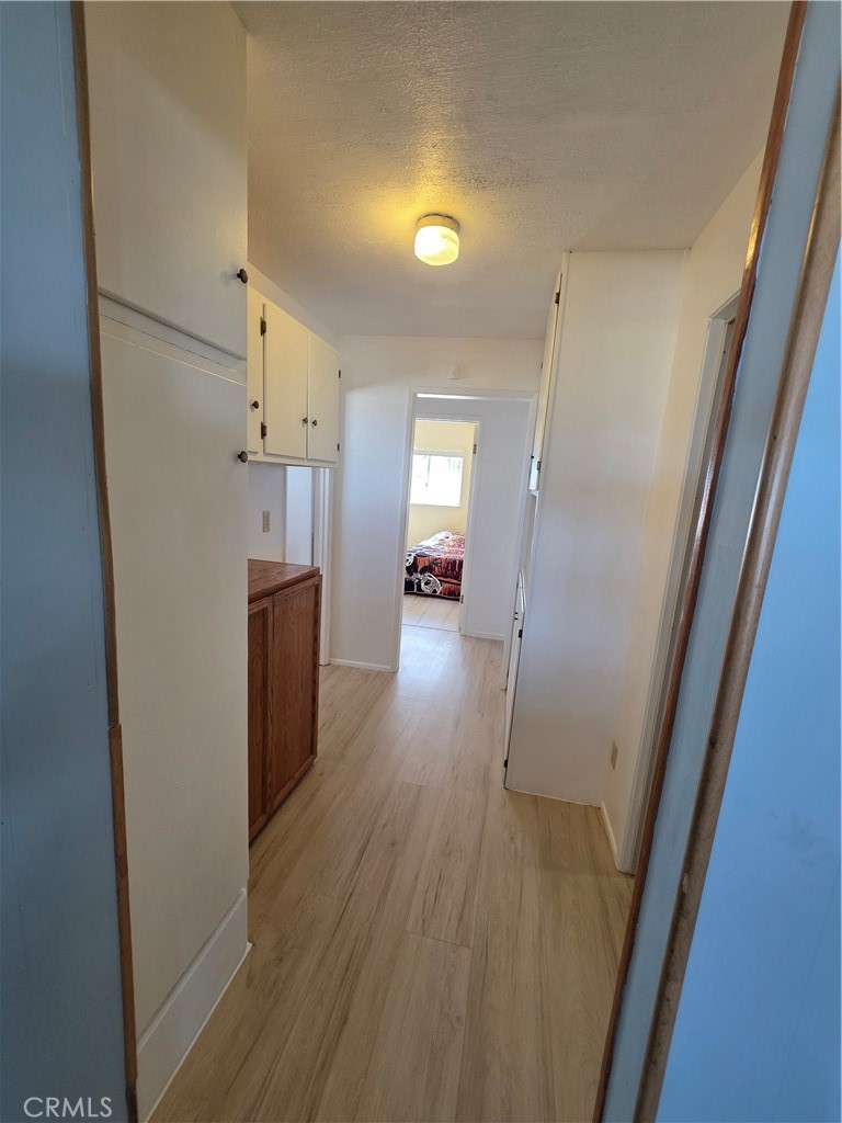 5566 Oleta Road Landers, CA 92285 - Photo 16 of 40 a view of hallway with wooden floor