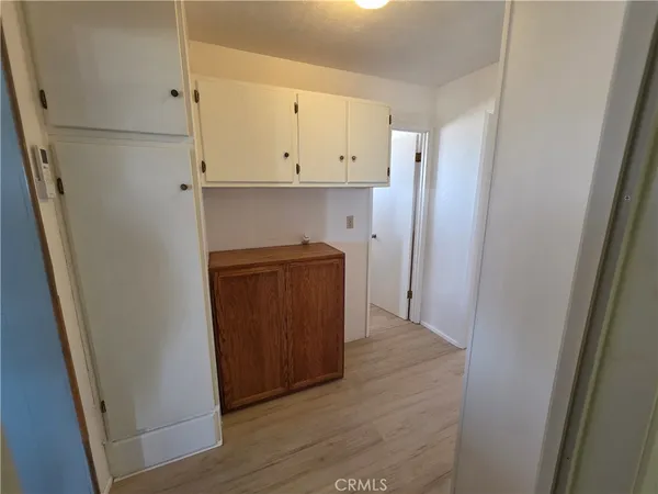 a view of hallway with wooden floor