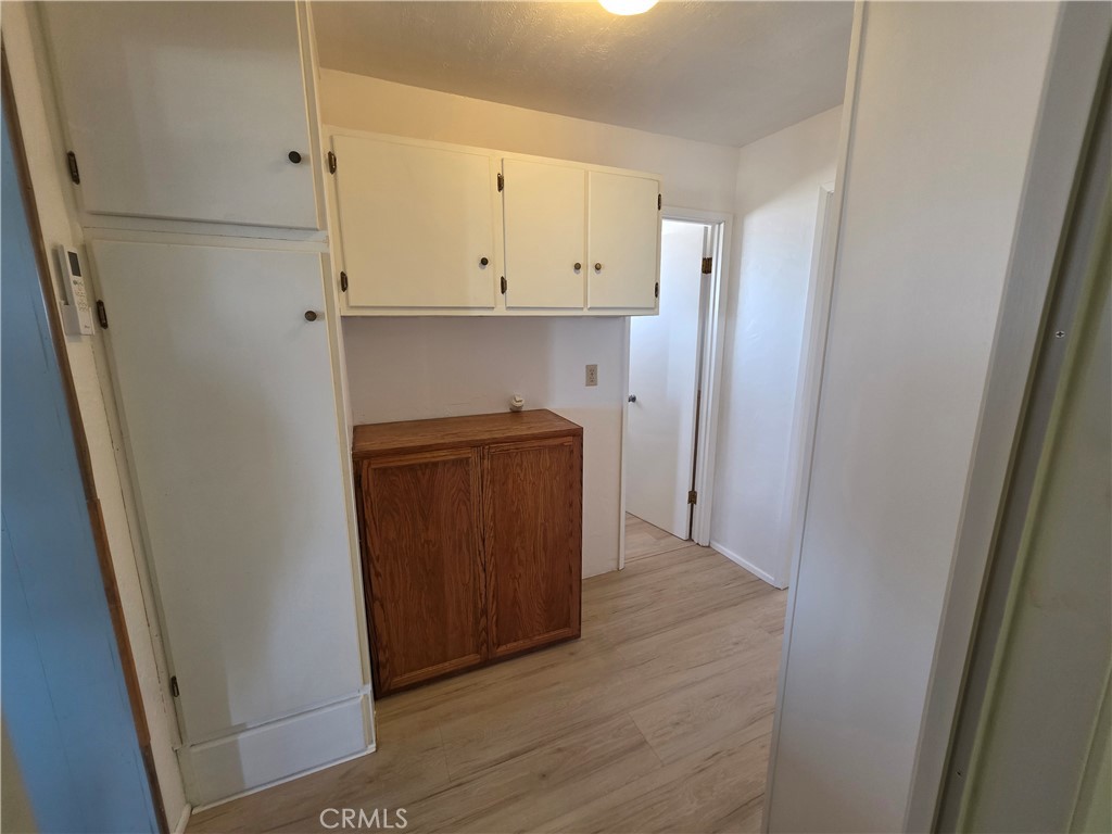 5566 Oleta Road Landers, CA 92285 - Photo 17 of 40 a view of hallway with wooden floor