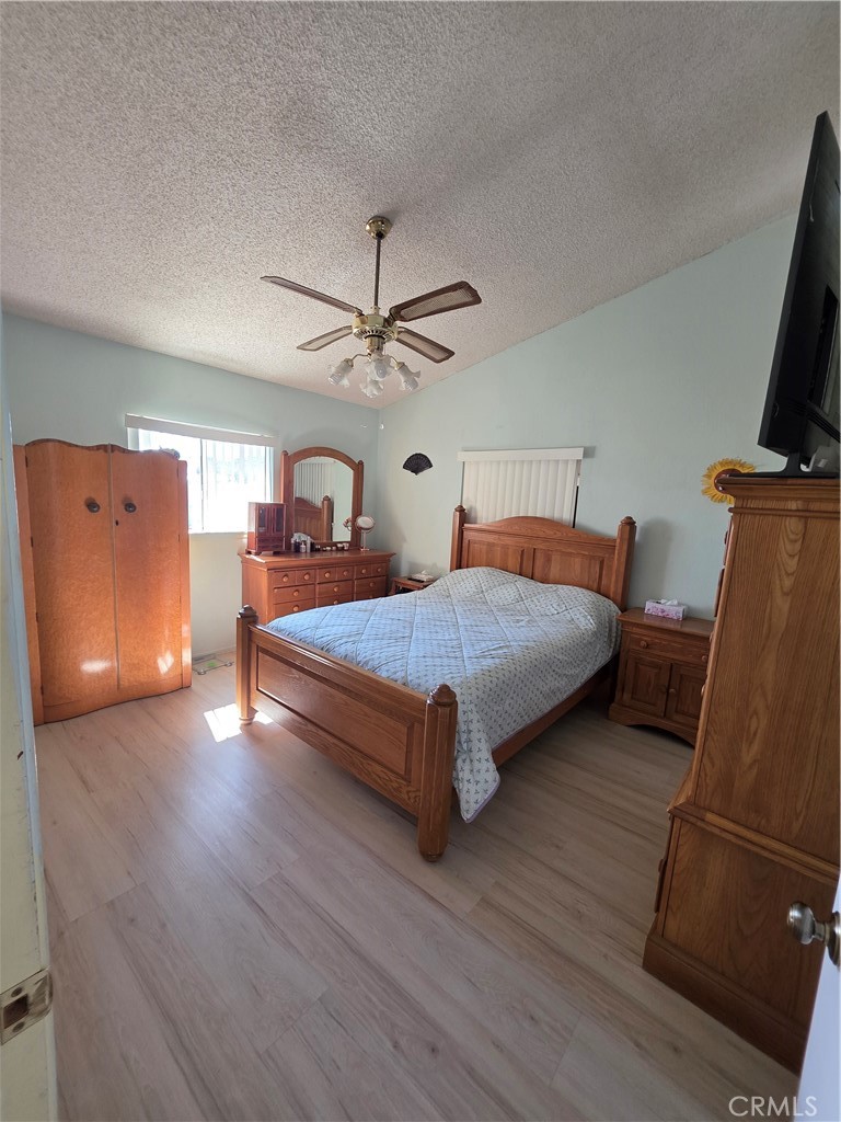 5566 Oleta Road Landers, CA 92285 - Photo 19 of 40 a bedroom with bed and window