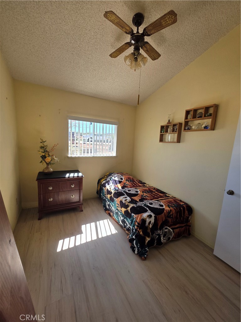 5566 Oleta Road Landers, CA 92285 - Photo 21 of 40 a bedroom with a bed and a window