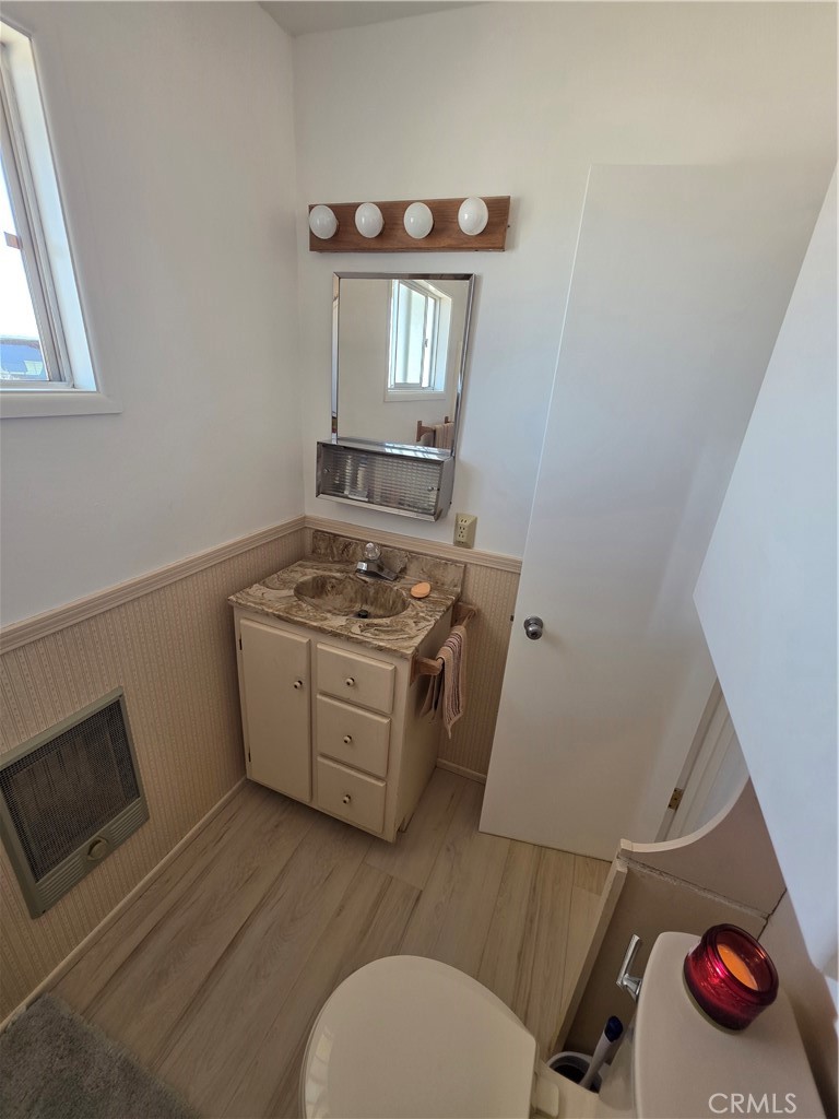 5566 Oleta Road Landers, CA 92285 - Photo 25 of 40 a bathroom with a toilet sink and mirror