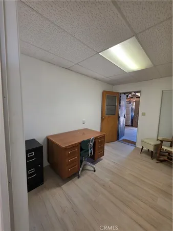 a room with wooden furniture and gym equipment