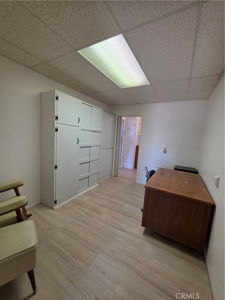 5566 Oleta Road Landers, CA 92285 - Photo 27 of 40 a room with a bed and cabinets
