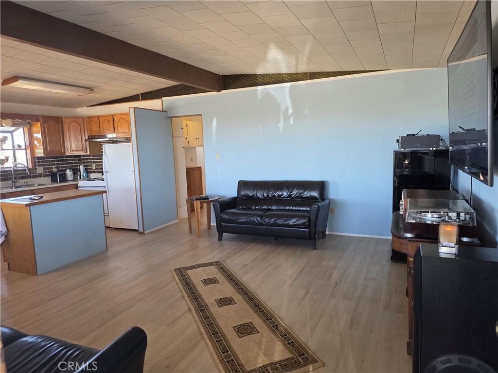 5566 Oleta Road Landers, CA 92285 - Photo 4 of 40 a view of kitchen and living room with furniture