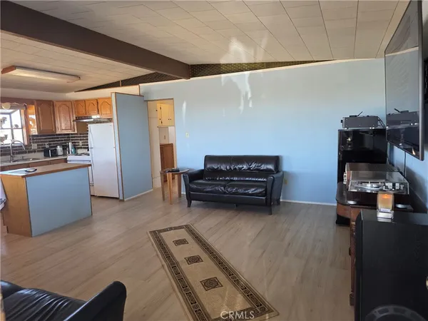 a view of kitchen and living room with furniture