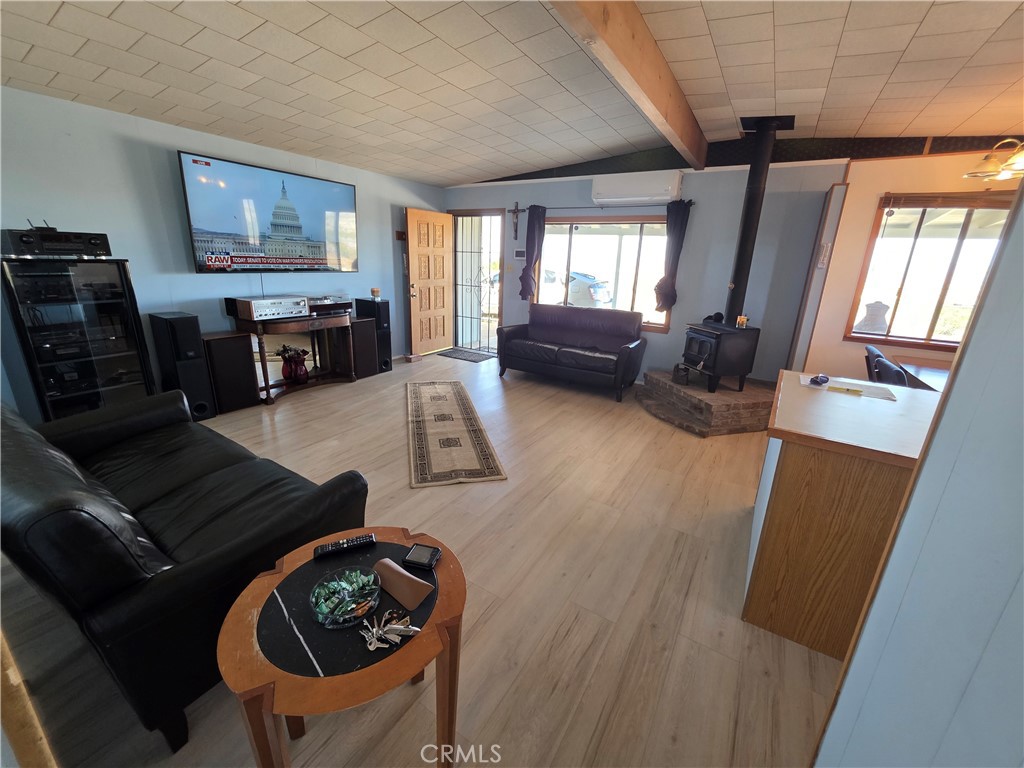 5566 Oleta Road Landers, CA 92285 - Photo 5 of 40 a living room with furniture window and wooden floor