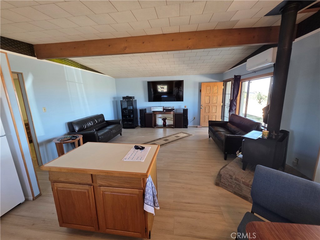 5566 Oleta Road Landers, CA 92285 - Photo 7 of 40 a living room with furniture and a flat screen tv
