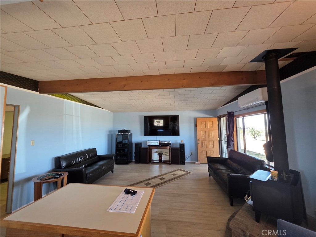 5566 Oleta Road Landers, CA 92285 - Photo 8 of 40 a living room with furniture and a flat screen tv