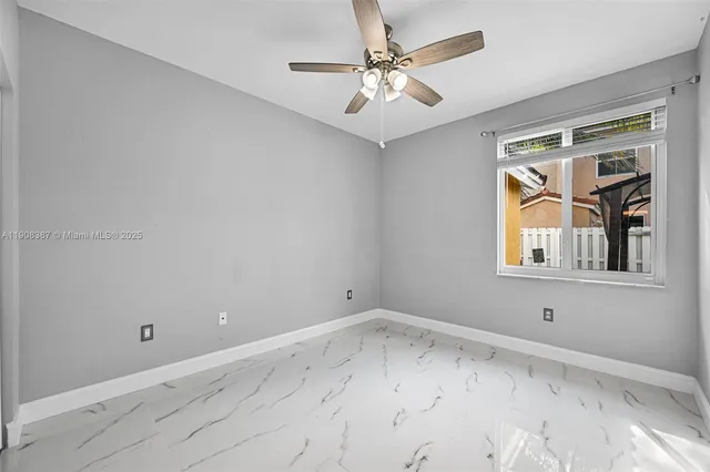 a bathroom with a toilet sink shower and mirror