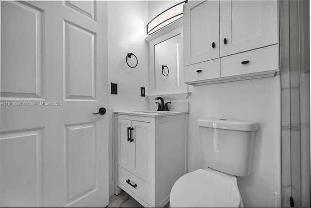 a kitchen with stainless steel appliances granite countertop a stove a microwave and cabinets