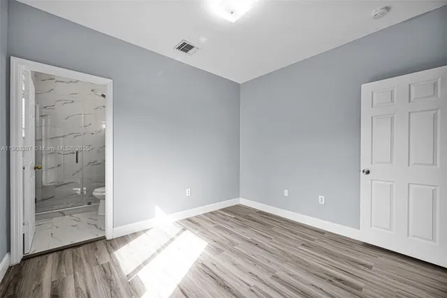 a view of storage and utility room with racks on the wall